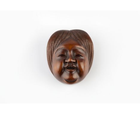 A carved wood netsuke mask of Ko-Otome early 19th Century signed Shumin (Hara), the smiling features framed by a delicately c