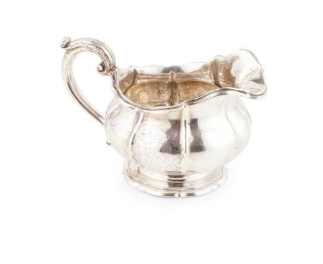 Paul Storr, London 1828 of squat panelled form with engraved armorial to sides, undulating rim, with leaf clasped S scroll ha