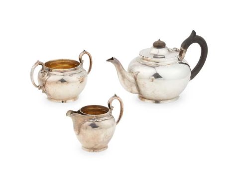 Daniel George Collins, London 1920, comprising a teapot, twin-handled sugar basin and milk jug, all of plain spherical form, 