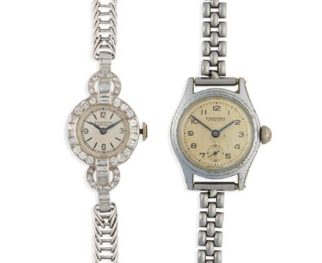 to include an International Watch Co. example, unmarked white metal case, manual wind movement, white dial with Arabic numera