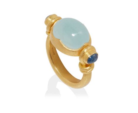 collet set in a swivelling mount with a cabochon aquamarine, each shoulder set with a cabochon sapphire, to a plain 18ct yell