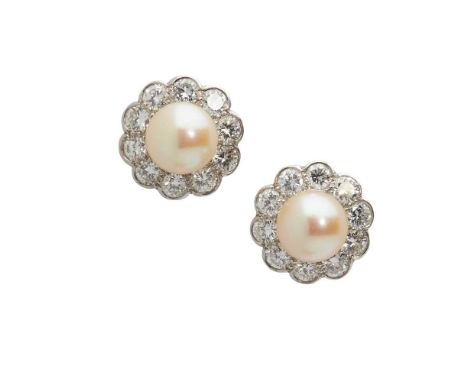 each set with a central pearl in a border of old round-cut diamonds, modelled in unmarked white metal, to post and butterfly 