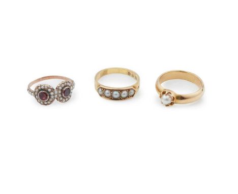 to include an 18ct gold ring set with five pearl halves; a single pearl set ring, stamped 18ct and a garnet and pearl double 