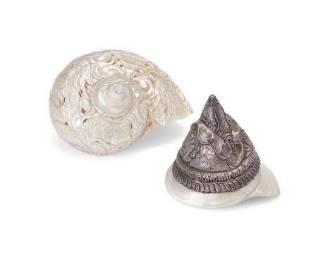 Two Chinese embellished conch shellsRepublic periodThe first left plain but mounted in silver to the mount with a makara head