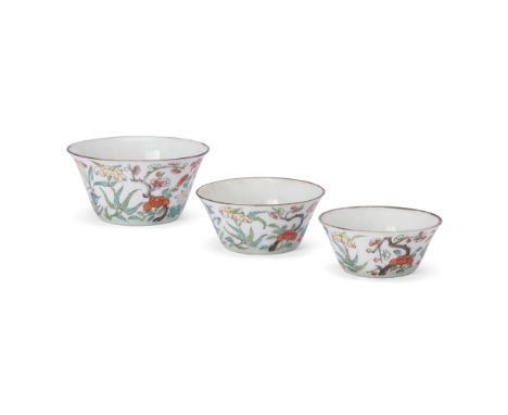 A part-set of three Chinese famille rose 'floral' nesting cupsQing dynasty, Jiaqing seal marks and of the periodEach finely e