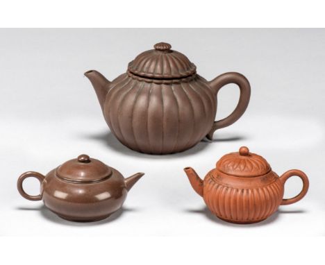 The Robert G. Vater CollectionThree Chinese Yixing teapots and coversLate Qing dynasty and Republic Comprising: two 'chrysant