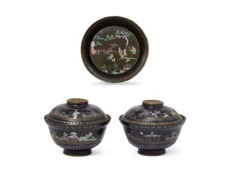 A pair of Chinese mother-of-pearl-inlaid tea bowls and covers and a saucerQing dynasty, 17th/18th centurySilver-mounted to ba