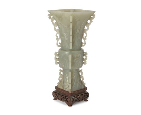 A Chinese greyish-green jade vase, fangguMing dynasty, 17th centuryWith pierced 'dragon' flanges to the sides and notched fla