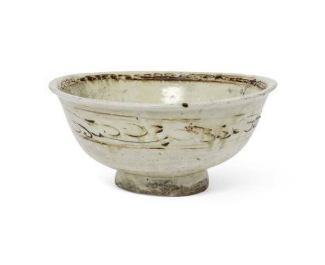 A large Thai Sawankhalok stoneware bowlSukothai/Ayutthaya, 15th/16th centuryThe deep rounded sides rising from a tall foot to