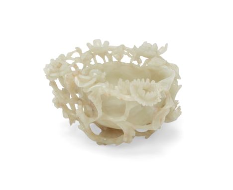 A large Chinese celadon jade reticulated 'prunus and chrysanthemum' water coupeLate Ming/early Qing dynasty, 17th centuryCarv