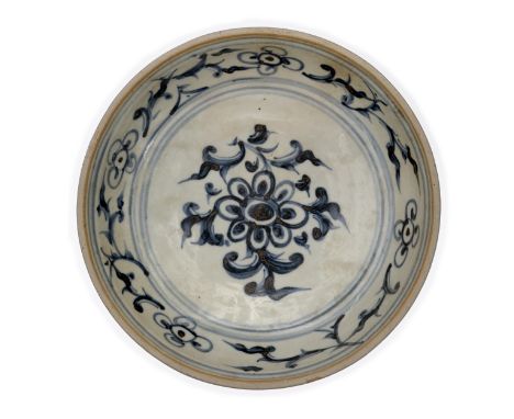 A blue and white Annamese dish15th/16th centuryStanding on short straight foot rising to deep sides and unglazed rim, painted