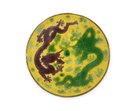 A Chinese aubergine and green-enamelled yellow-ground 'dragons' circular fragmentQing Dynasty, Daoguang mark and of the perio