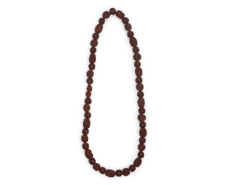 A Chinese carved fruit pit ‘Wu shuang pu’ rosary bead necklaceLate Qing dynastyComprised of forty-eight alternating beads car