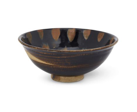 A Chinese Henan black-glazed russet-splashed bowlJin/Yuan dynastyOf gently rounded shape rising to an everted rim, the bowl c