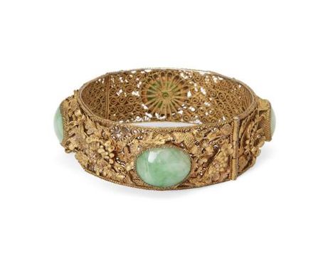 A Chinese jadeite-inset silver-gilt filigree braceletLate Qing dynasty/Republic periodDelicately worked with a meander of lea