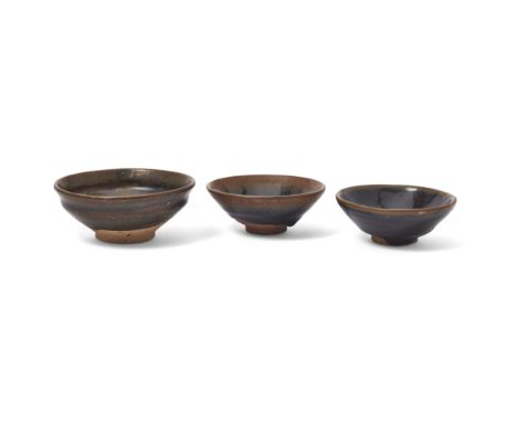 Two Chinese Jian 'hare's fur' tea bowls and a brown-glazed tea bowlSong dynastyThe first tea bowl covered overall in a richly