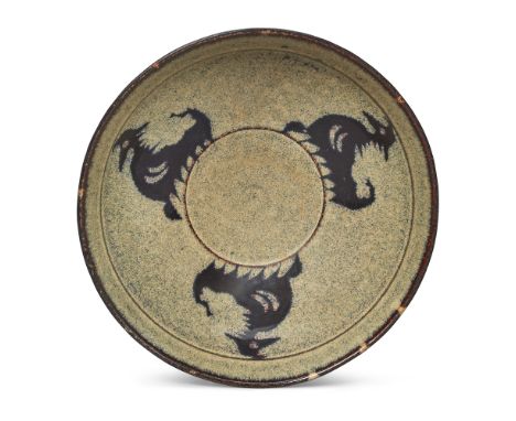 A Chinese Jizhou-type paper-cut 'cockerels' tea bowl20th centuryThe interior covered in a phosphatic-type bluish/white glaze 