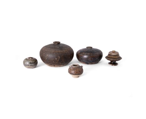 Four Cambodian Khmer vessels and a Thai Sawankhalok box and cover11th-15th centuryComprising two Khmer brown-glazed compresse