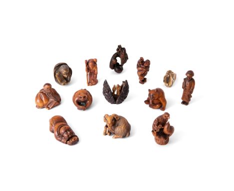 A group of twelve Japanese netsuke and a small nut okimonoMeiji/Taisho periodComprising twelve boxwood netsuke: a Jurojin, a 