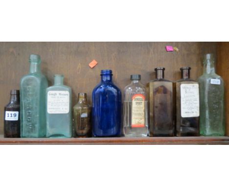 SHELF LOT OF CHEMIST BOTTLES