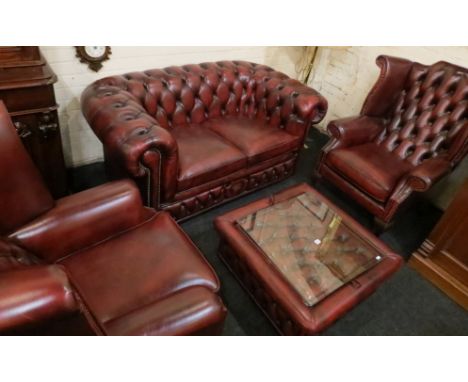 2 SEATER SETTEE &amp; 2 HIGH BACK ARMCHAIRS IN OX BLOOD LEATHER &amp; BUTTON BACK TOGETHER WITH MATCHING STORAGE STOOL/COFFEE