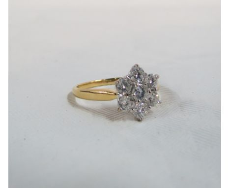 18 CARAT GOLD &amp; DIAMOND CLUSTER RING WITH 7 ROUND BRILLIANT CUT DIAMONDS WITH TOTAL WEIGHT BEING CIRCA 1 CARAT. DIAMONDS 