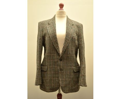 A 1980s single breasted coat in black and white 100% Pure New Wool houndstooth, flecked with threads of yellow, orange, red a