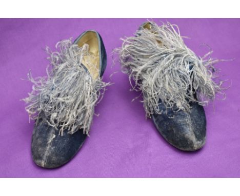 A pair of 1940s dancer's shoes, in blue crushed velvet and featuring a powder blue ostrich feather plumage to the upper arch 
