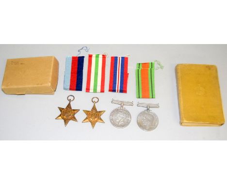 A WW2 medal group of four including the Italy Star with box and his Active Service Bible whish is named to 14991424 E.Floyd o