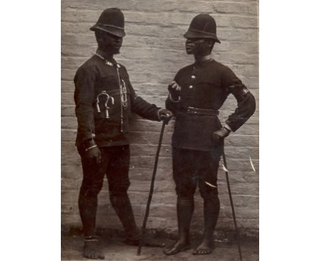 NO RESERVE Photographs.- Unidentified Photographer. Two Colonial Policemen, in uniform of British police jacket and helmets b