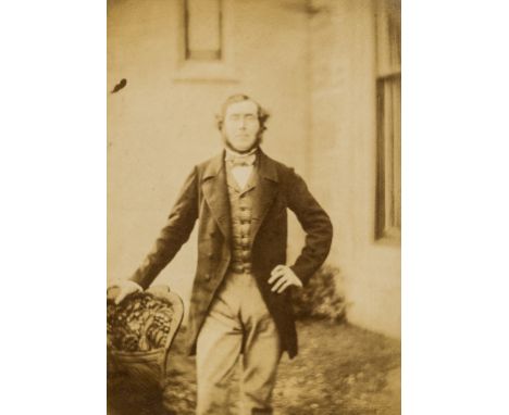 *** Please note, the description of this lot has changed ***Photographs.- Unidentified Photographer. Man standing on steps in