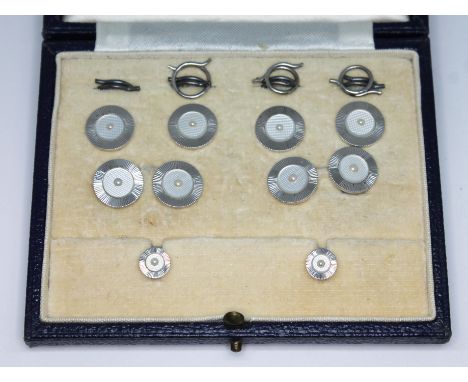 An Art Deco mother of pearl and pearl cufflink and button set, maker's mark 'C&amp;F' and also marked '9ct', gross wt. 12.43g