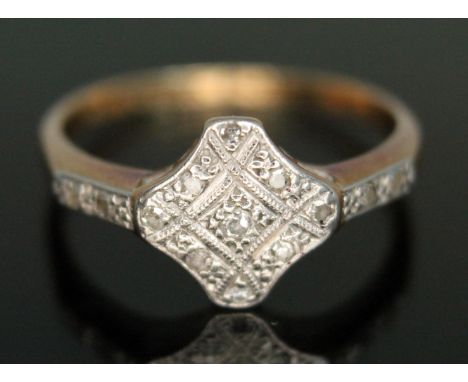 An early 20th century Art Deco diamond cluster ring, marked '18ct PLAT', gross wt. 2.69g, size M.  Condition - good, minor we