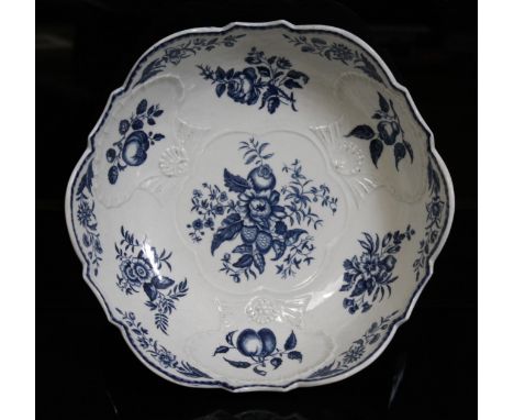 A Worcester Pinecone pattern bowl, circa 1775, of shaped form and impressed with clam shells, decorated in underglaze blue wi