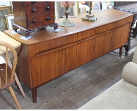A mid century teak sideboard by Remploy, c.1960s, height 74cm, length 186cm and depth 49cm. Some wear to include marks and li