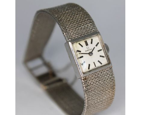 A 1970 hallmarked 9ct white gold Omega ladies wristwatch 7115698, with integrated 9ct white gold strap hallmarked to both end