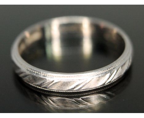 A Boodles engraved platinum wedding band, sponsor's mark 'CG&amp;S', Birmingham 1986, inscribed 'Boodles', wt. 3.21g, size M.