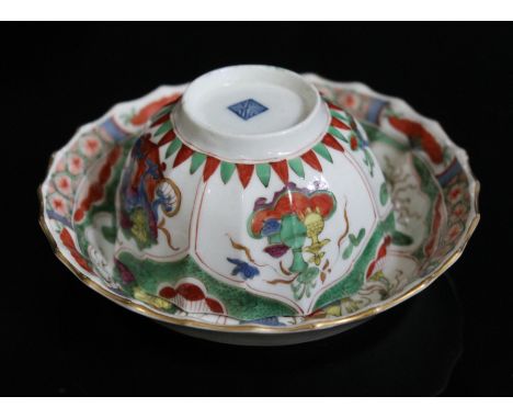 A Worcester porcelain tea bowl and saucer, 18th century, decorated with Dragons in Compartments pattern, square mark to base.