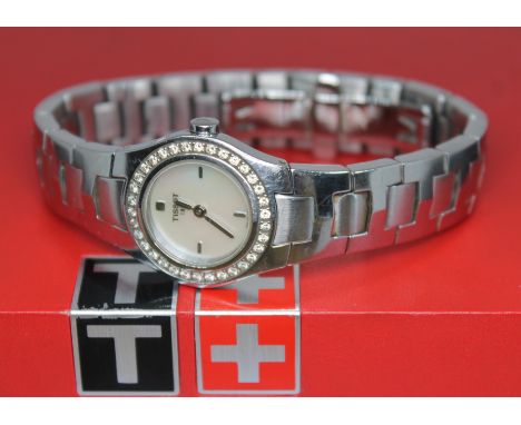 A ladies stainless steel and diamond bezel Tissot L522 quartz wristwatch, with signed mother of pearl dial, 23mm case having 