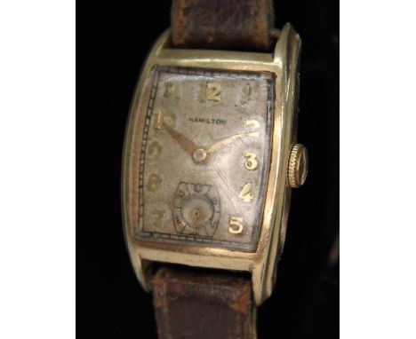 A 1940s Hamilton 10K gold filled dress watch, the signed dial having Arabic numerals and hands in gold tone with seconds subs