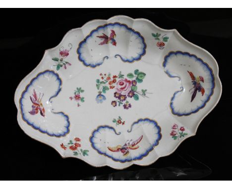 A Worcester lozenge shaped porcelain dish, circa 1770, decorated in the workshop of James Giles, with exotic birds within blu