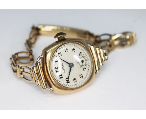A 1950s hallmarked 9ct gold Rotary 15 jewel manual wind ladies wristwatch on rolled gold strap, the case hallmarked Birmingha