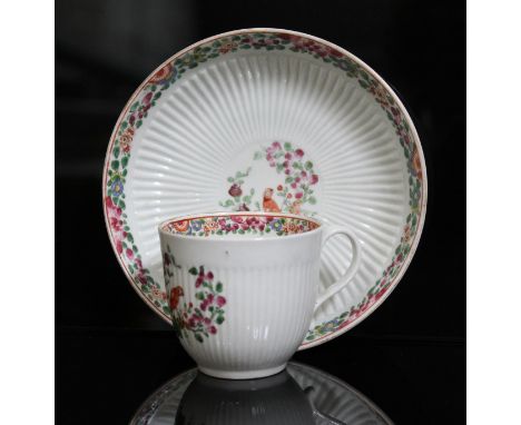 A Worcester porcelain cup and saucer, circa 1765, reeded form and decorated in Old Worcester Parrot pattern, J W Goldsmith Co