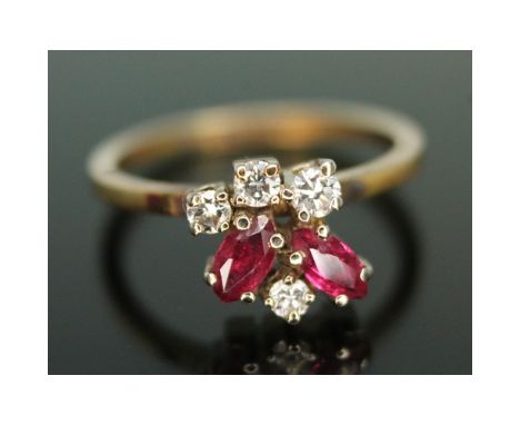 A diamond and ruby cluster ring, the random cluster set with two marquis rubies and three modern round brilliant diamonds, cl