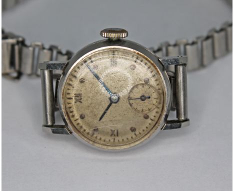 A stainless steel IWC ladies manual wind wristwatch, circa 1942/43, the unsigned patinated dial having Roman numerals and cir