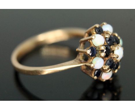 A sapphire and precious opal cluster ring, cluster diam. approx. 12mm, hallmarked 9ct gold, gross wt. 2.52g, size M.  