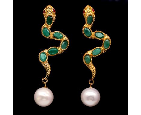 A pair of gold on 925 silver snake shaped drop earrings set with pearls, oval cut emeralds and ruby eyes, L. 5.6cm.