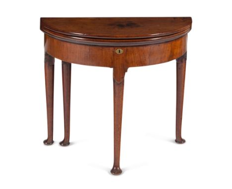 A George I Walnut Demilune Game Table&nbsp;Circa 1720with a felt-lined gaming surface, the interior fitted with mahogany vene