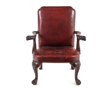 A George II Leather-Upholstered Carved Mahogany Library ChairMid 18th Century and AdaptedHeight 41 1/4 x width 32 1/2 inches.