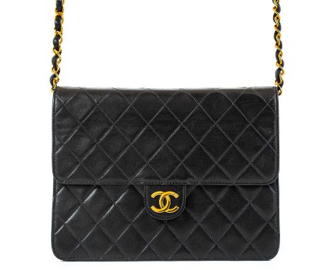 A Chanel black quilted lambskin single flap wallet shoulder bag. Circa 1997-99, gold-tone hardware, burgundy leather interior